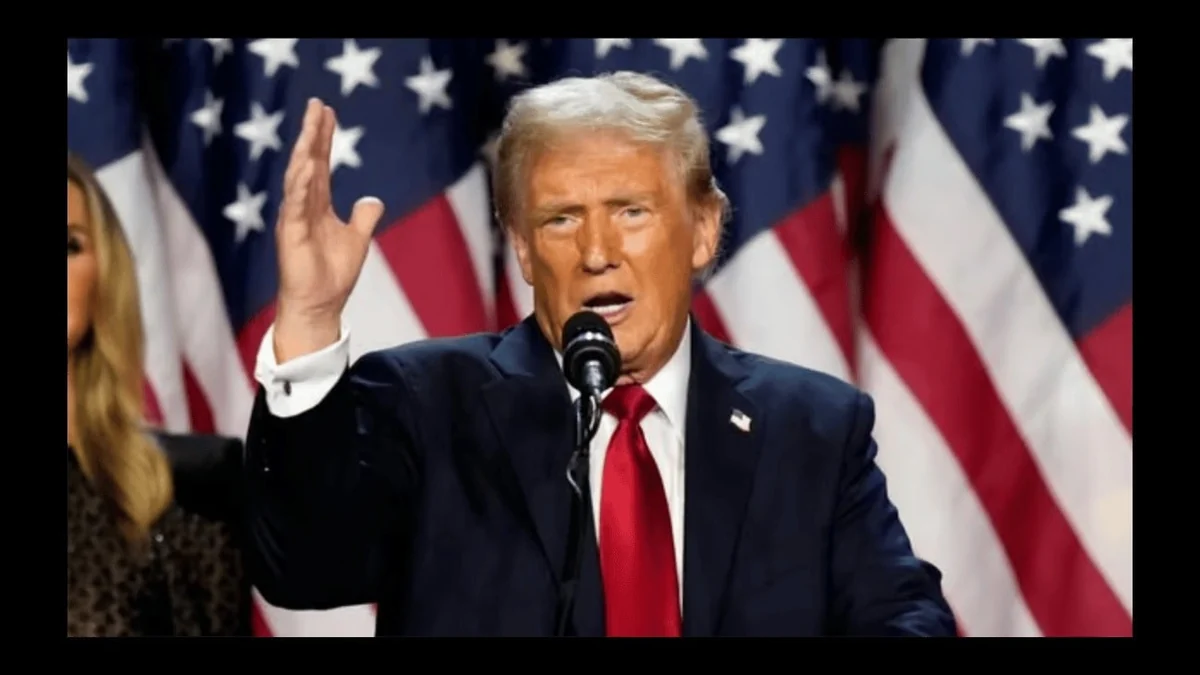 Donald Trump speaking at a lectern in front of US flags