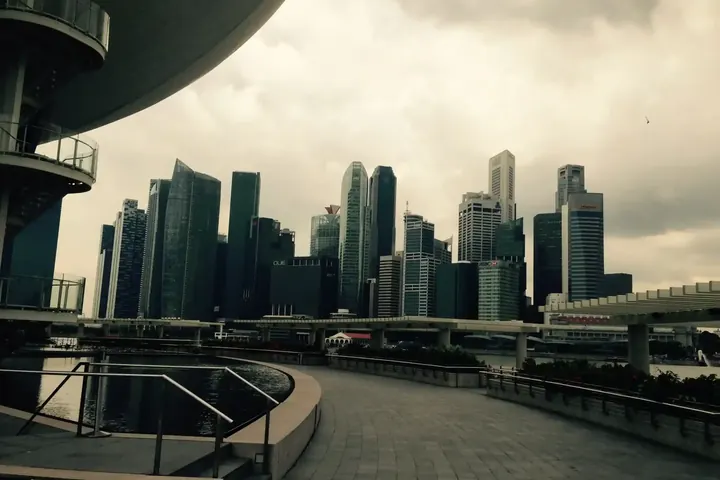 Singapore's central business district seen from a raised walkway on an overcast day